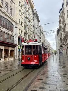 Red Tram on Rainy Istiklal Street in Istanbul