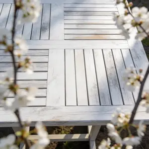 Weathered White Wooden Outdoor Table with Blooming Branches