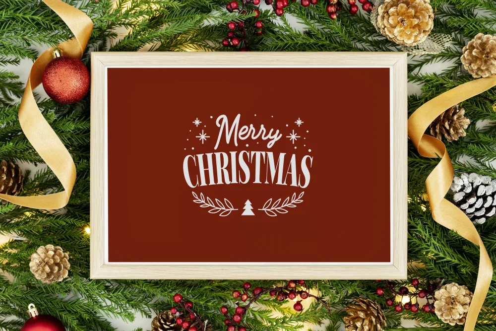 Merry Christmas Sign with Festive Evergreen and Decorations