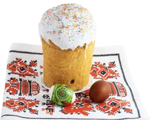 Easter Kulich Cake with Decorated and Brown Easter Eggs on Embroidered Cloth